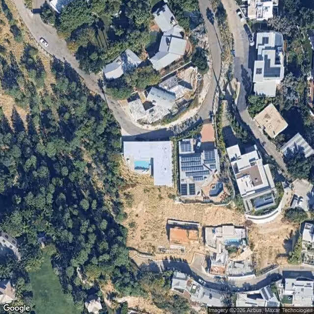 Aerial perspective of the surrounding area of the Stahl House, highlighting its hilltop position.