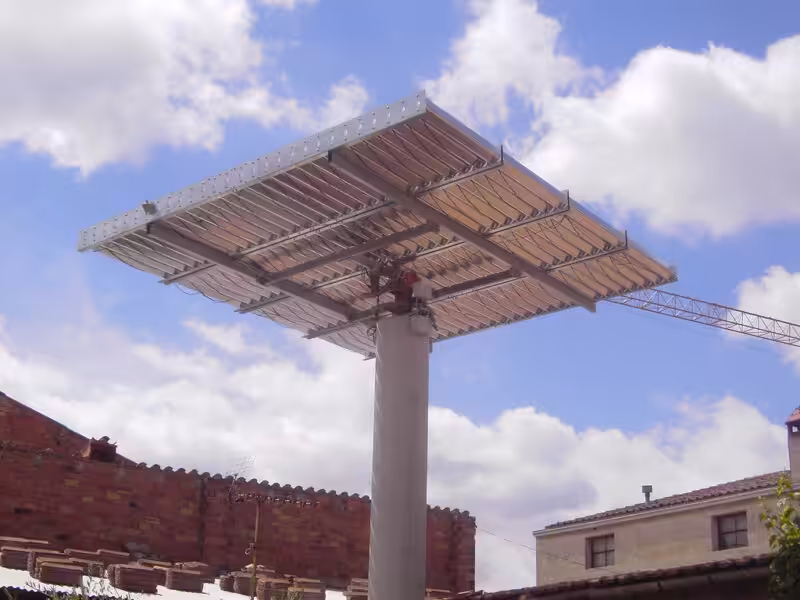 Solar panels with a backdrop of brick buildings