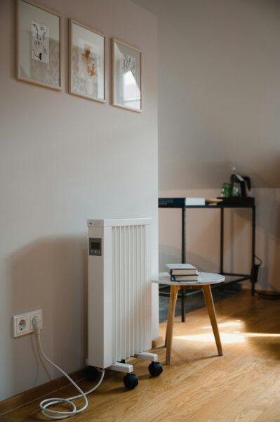 Small heater next to table with books