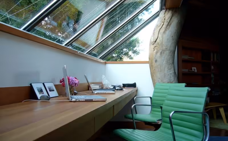 A creative office space showcasing various design elements and open shelving for organization.