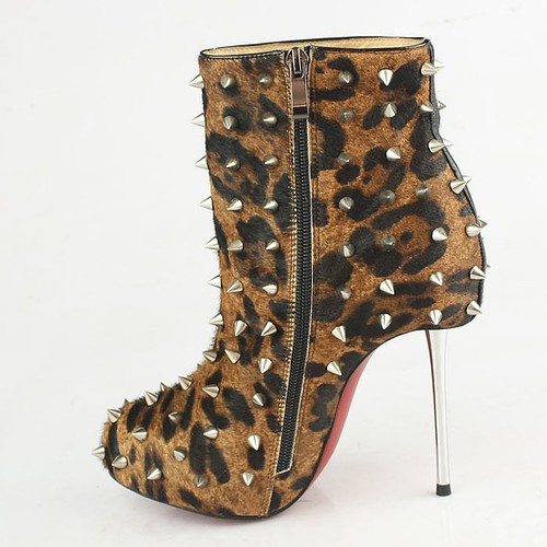 Showcasing a collection of Christian Louboutin shoes at a fashion outlet