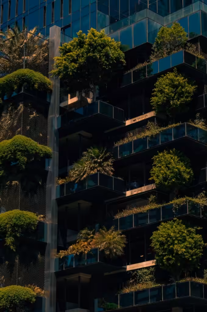 Innovative urban architecture with green vertical garden on building facade showcasing modern environmental design.