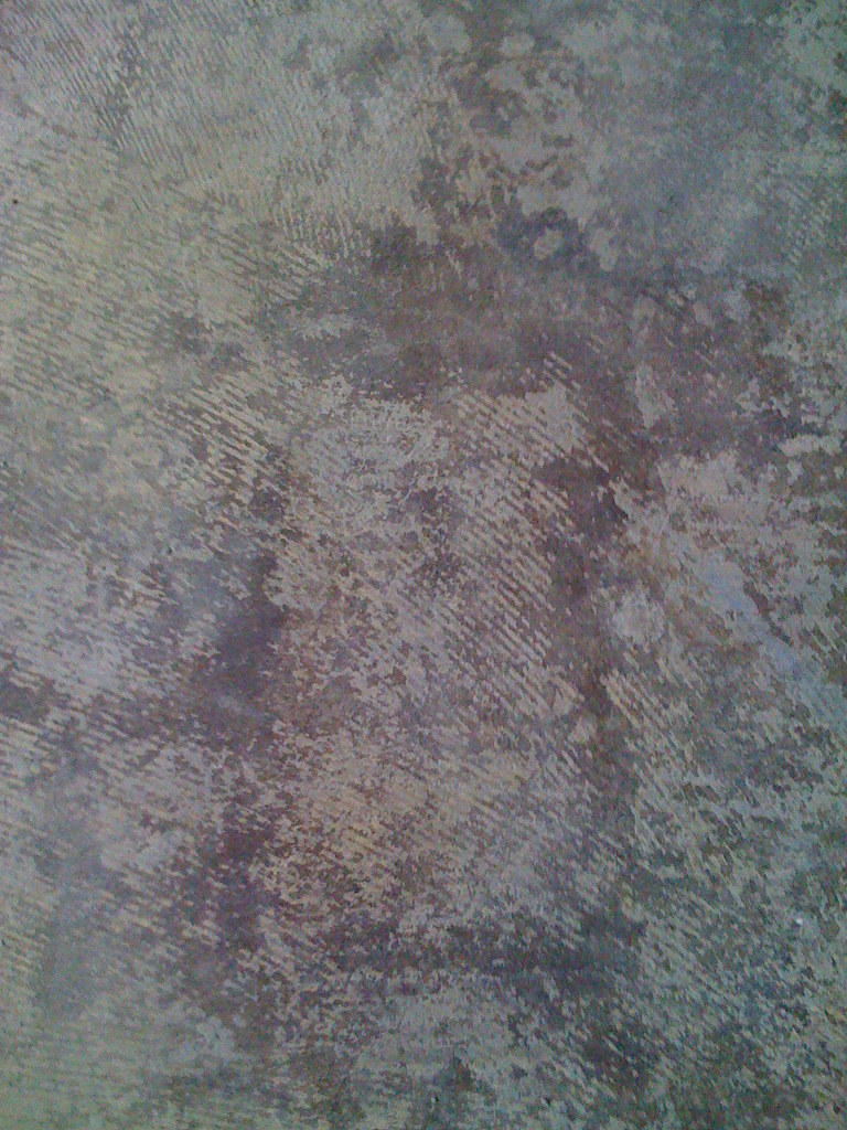 Concrete flooring with tile adhesive
