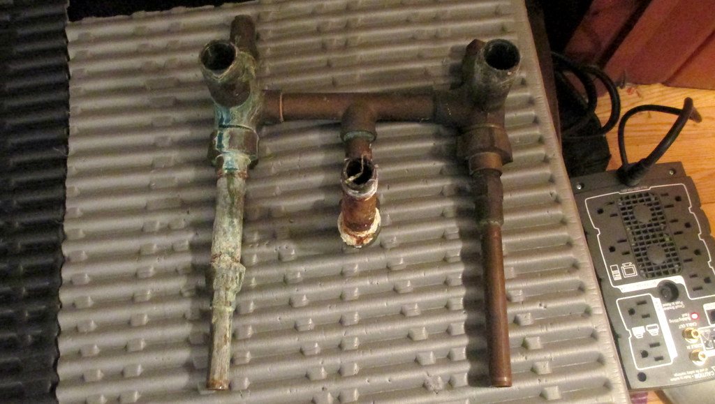 Old tub pipes with a leaky hot water connection