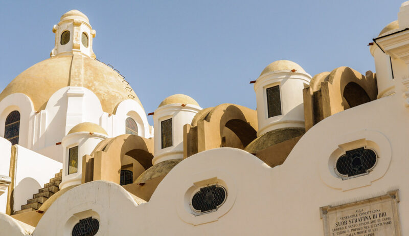 A historical church roof in Capri showcasing traditional architectural roofing styles.