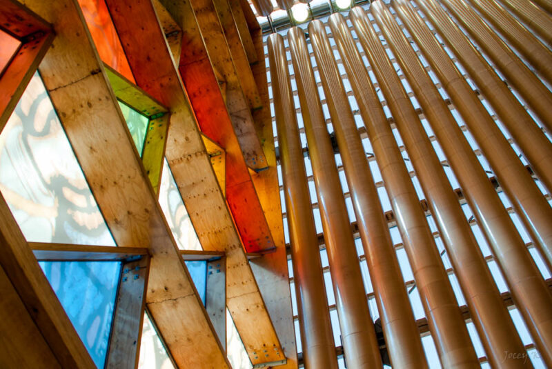 A structured view featuring wooden and glass materials potentially used in roofing.