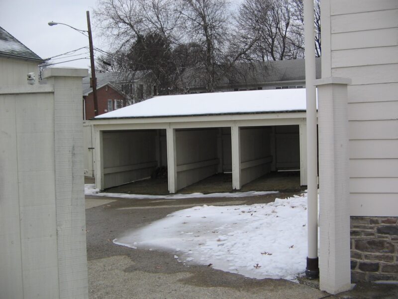 A set of wood sheds, illustrative of diverse styles and sizes for outdoor storage solutions.