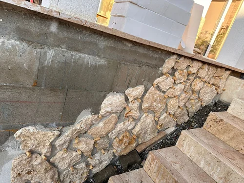 Defined natural stone pathways provide elegant, durable access through the landscape.