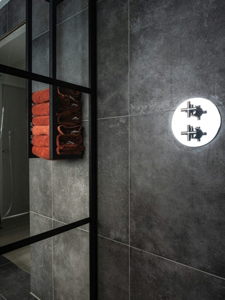 White cross on gray wall in a modern interior setting