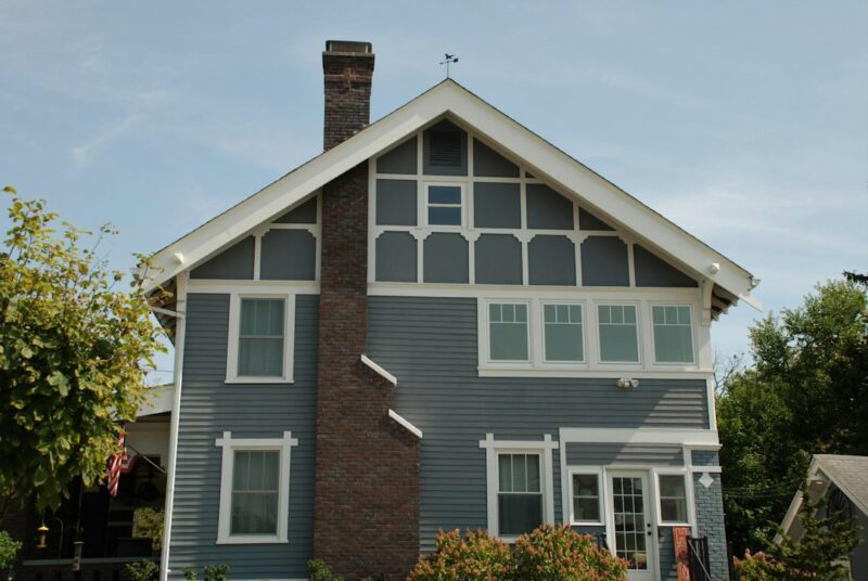 brown brick house with white wooden door