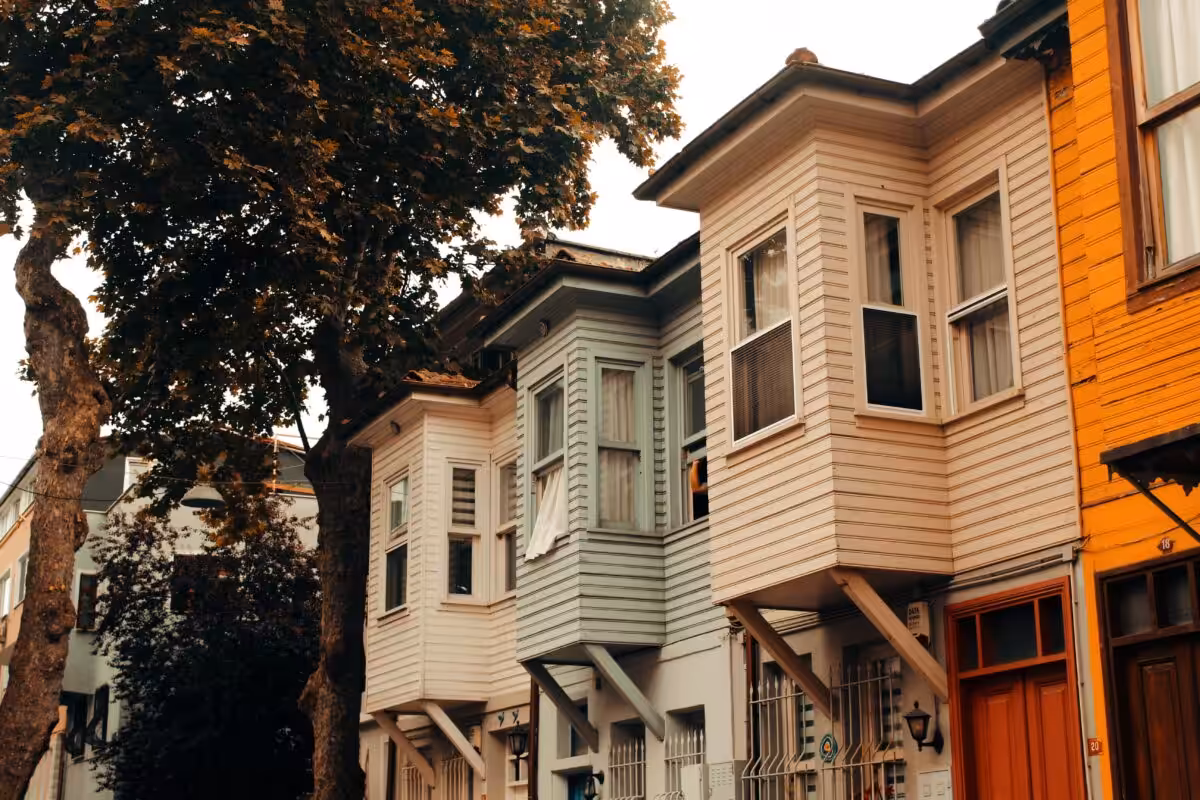 A picturesque view of colorful traditional houses lining a quiet urban street, embodying architectural charm.