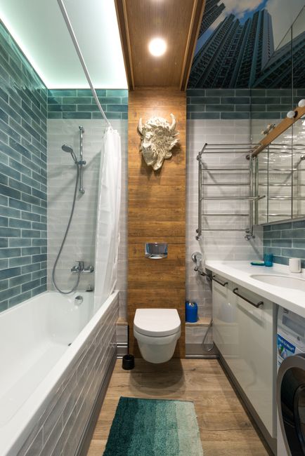Contemporary bathroom featuring modern design elements and unique decor in blue and wooden tones.